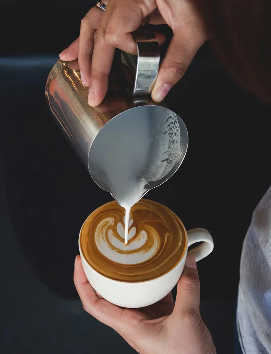 a person pouring coffee